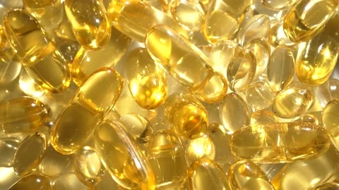 Vitamins D, capsules omega 3, macro Stock Footage 231794580