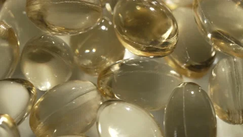 Vitamins D, capsules omega 3, macro Stock Footage 231794657