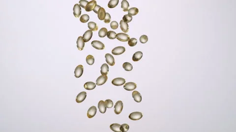 Vitamins falling in the air. Slow Motion. Stock Footage 50512101