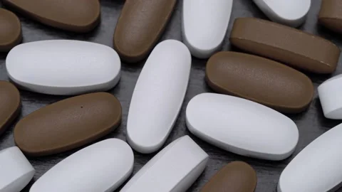 Vitamins in the form of pills on a black background. Stock-Footage 149479504