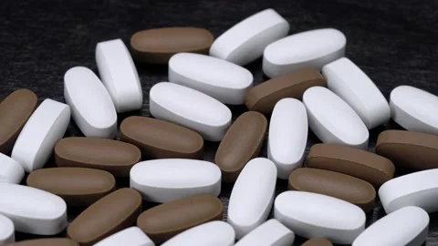 Vitamins in the form of pills on a black background. Stock Footage 149675299