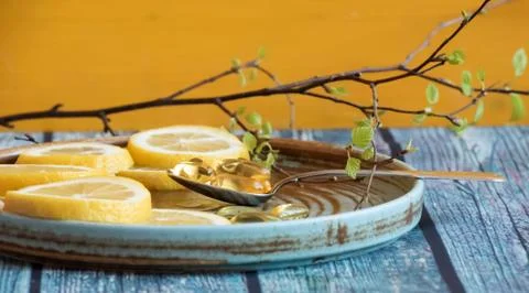 Vitamins needed in the spring - Vitamin C in lemon and fish oil Stock Photos