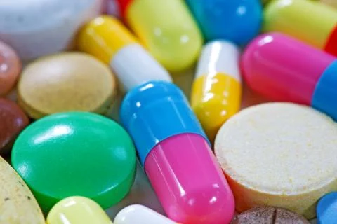 Vitamins, omega 3, cod-liver oil, dietary supplement and tablets an embankmen Stock Photos