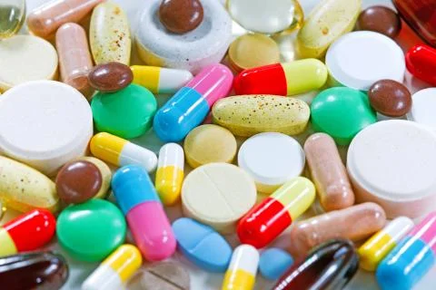 Vitamins, omega 3, cod-liver oil, dietary supplement and tablets an embankmen Stock Photos