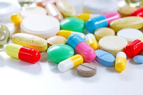 Vitamins, omega 3, cod-liver oil, dietary supplement and tablets an embankmen Stock Photos