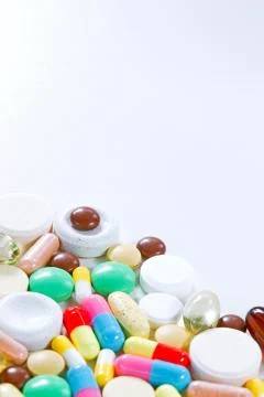 Vitamins, omega 3, cod-liver oil, dietary supplement and tablets an embankmen Stock Photos