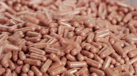 Vitamins Piling Up In Capsule Production Line On Final Stages of Manufacturing Stock Footage 50032203