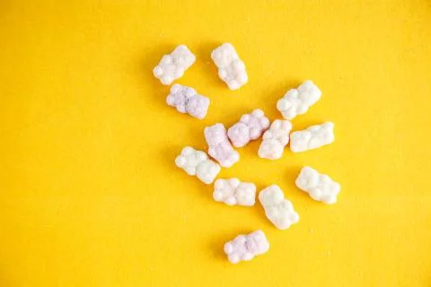 Vitamins on yellow background Stock Photos