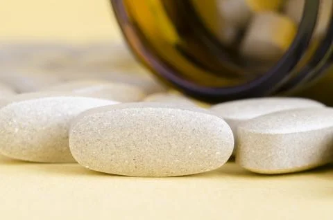 Vitamins on a yellow background Stock Photos