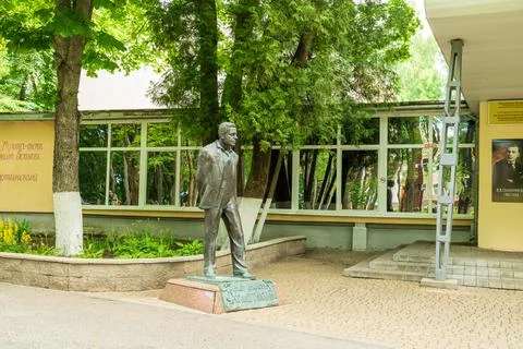 Vitebsk, Belarus. Bronze statue of Ivan Sollertinsky in mid-stride on a sto.. Stock Photos