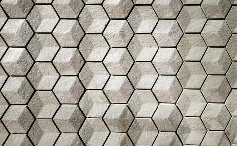 Vitrified tiles in a hexagonal geometrical pattern with grey and white textur 스톡 사진