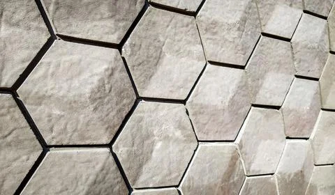 Vitrified tiles in a hexagonal geometrical pattern with grey and white textur Stock-Fotos