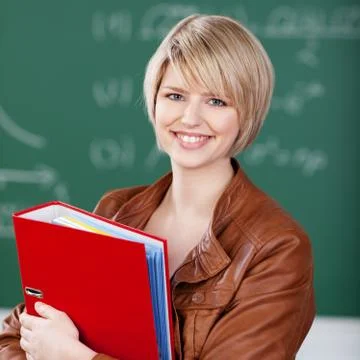 Vivacious female student with class notes Stock Photos