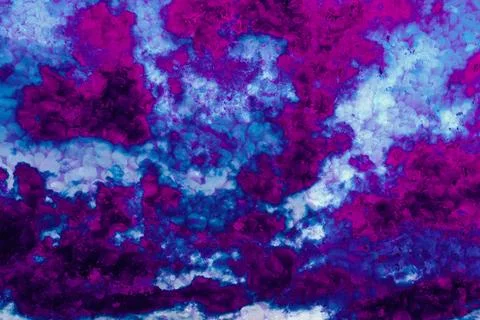 Vivid abstract cloudscape rendered in intense purples, blues, and magentas Stock Photos