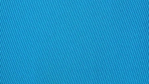 Vivid blue textured fabric surface with diagonal woven pattern for backgrou.. Vidéo 333806233