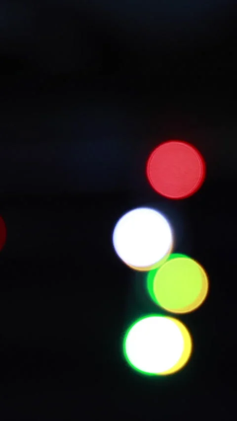 Vivid Circular Bokeh Lights In Red, Blue, Green, And White. Vertical. Stock Footage 306188120