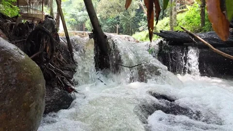 Vivid Close-Up of Fast River Current Flowing Over Rocks Stock Footage 345471305