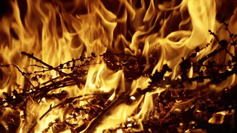 A vivid close-up view capturing the intense flames, swirling smoke, and glowing Stock Footage 312509373