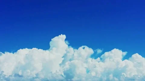 Vivid Cumulus Clouds Against a Deep Blue Sky Video stock 309286943