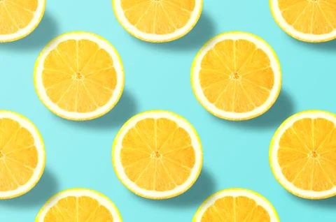 Vivid fruit pattern of fresh lemon on colourful background Stock Photos