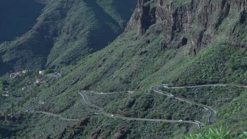 Vivid Mountain Scene. Elevated Perspective Showcasing Winding Road Through Lush Stock Footage 328046129
