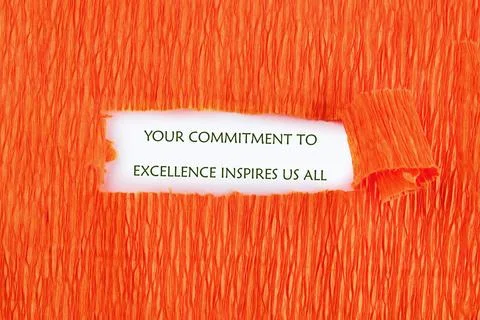 Vivid orange backdrop features a powerful message about commitment and exce.. Stock Photos