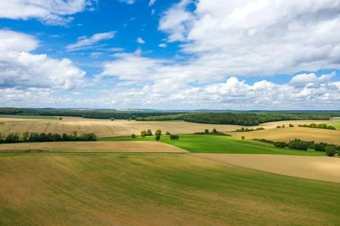 Vivid patchwork of fields under dramatic sky Foto stock