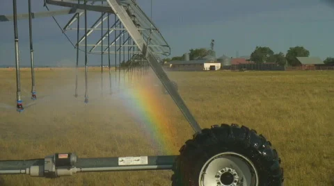 Vivid rainbow effect produced by center pivot irrigation system Video stock 142857