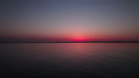 Vivid Red Blue Gradient Sky Over The Ocean At Dusk - aerial drone shot Stock Footage 159875849