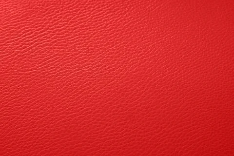Vivid red leather texture background with detailed grain pattern, abstract ma Stock Photos