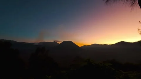 Vivid sunset colors casting over Mount Bromo and Tengger Caldera in East Java Stock-Footage 320387393