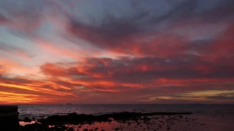 Vivid sunset colors in clouds. Cerberus Beach Melbourne, Victoria, Australia. 库存影片 49327176