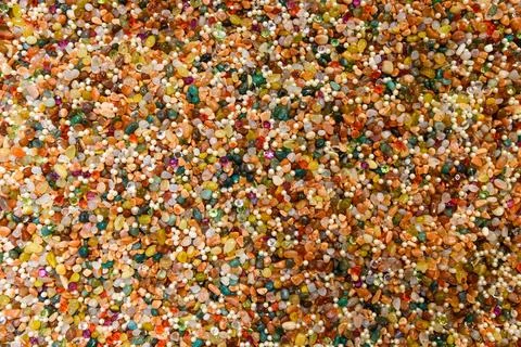 Vivid surface full of mixed gems, pearls, and beads. Decorative stones in r.. 写真素材