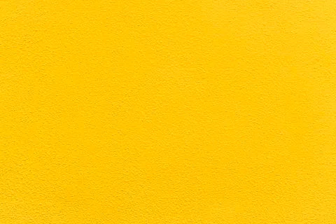Vivid yellow concrete texture pattern simple background wall concept empty co Stock Photos