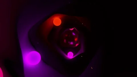 Vj Loop of orange and purple balls in a cave tunnel Video stock 234322832