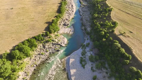 Vjosa river  flowing through mountains and green landscape. Stock Footage 212339537