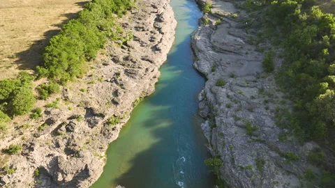 Vjosa river  flowing through mountains and green landscape. Stock Footage 212339903