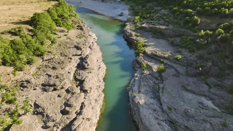Vjosa river  flowing through mountains and green landscape. 動画素材 212340128