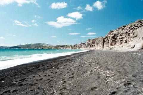 Vlichada black sand beach in Santorini. Stock Photos