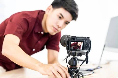 Vlogger blogger set up live camera Young asian male blogger setting up cam... Stock Photos
