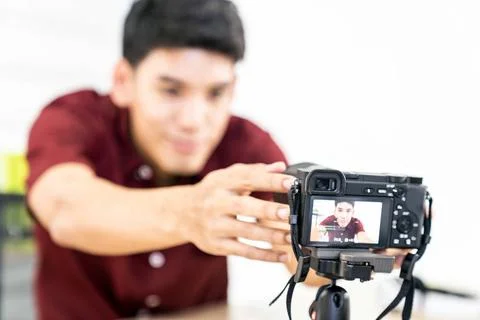 Vlogger blogger set up live camera Young asian male blogger setting up cam... Stock Photos