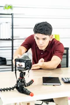 Vlogger blogger set up live camera Young asian male blogger setting up cam... Stock Photos