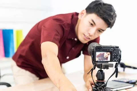 Vlogger blogger set up live camera Young asian male blogger setting up cam... Stock Photos