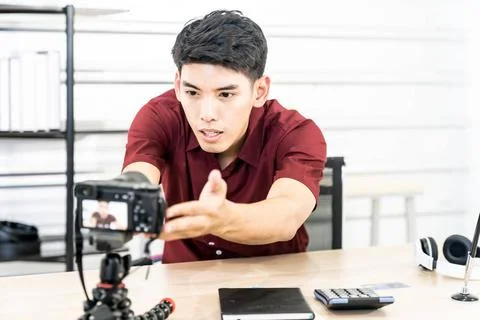 Vlogger blogger set up live camera Young asian male blogger setting up cam... Stock Photos