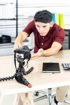 Vlogger blogger set up live camera Young asian male blogger setting up cam... Stock Photos