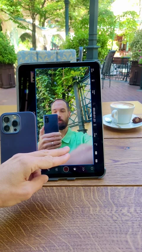 Vlogger Demonstrating Video Shooting on Tablet and Smartphone Stock Footage 313477042