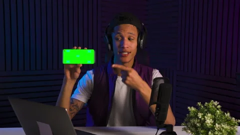 Vlogger multi-ethnic guy emotionally talking about smartphone application Stock Footage 147059927