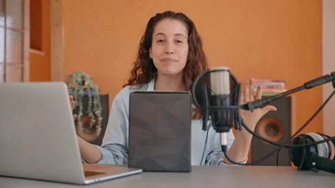 Vlogger or content creator is filming an unboxing video in her home studio Stock Footage 218474027