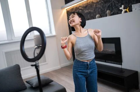 Vlogger recording a dance tutorial video for her digital audience Stock Photos