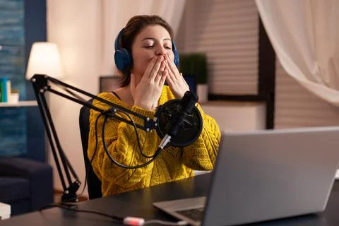 Vlogger speaking with follower on live using professional microphone Stock Photos